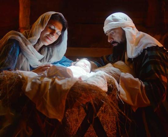 Mary and Joseph caressing baby Jesus after the virgin birth. Source: Framestock/Adobe Stock
