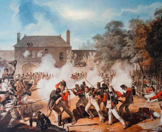 Battle of Waterloo soldiers fighting at the Hougoumont Chateau as portrayed in a watercolor by Denis Dighton. Source: Public Domain