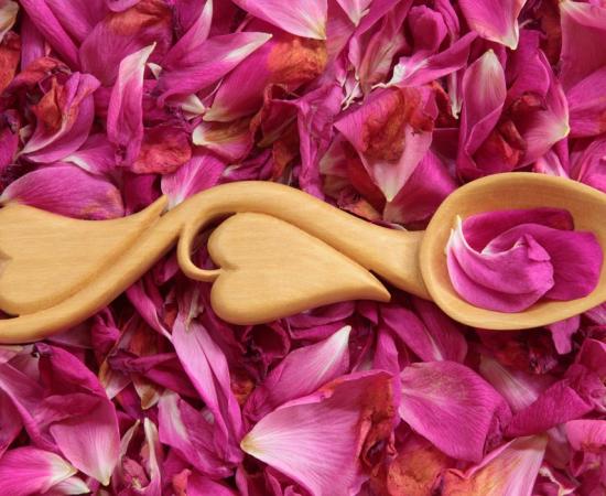 Modern Welsh love spoon on flower petals