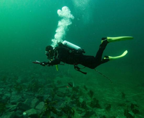 Marine archaeologist Christopher F. Kvæstad documents the stone belt in Grindasundet, Norway