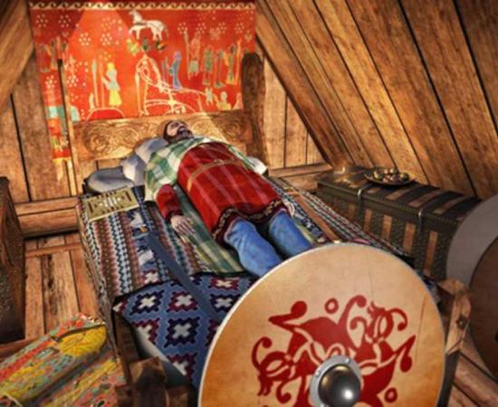 Reconstruction of the Myklebust Viking ship burial chamber c. year 870 AD, Norway, probably containing King Audbjorn of the Fjords. The king’s head is resting on pillows filled with bird feathers.