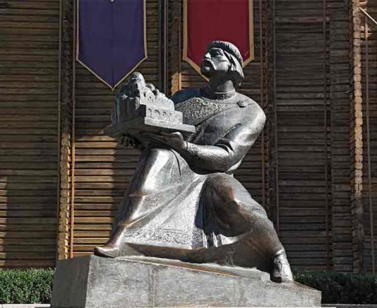Monument of Prince Yaroslav the Wise holding the cathedral of St. Sophia, at the entrance to the Golden Gate of Kiev, Ukraine. Source: lesniewski/Adobe Stock