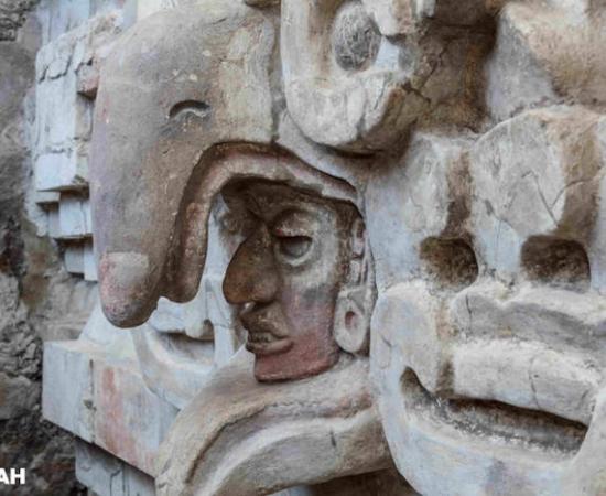Close up of owl beak over a face above the entrance to the Zapotec tomb found in Mexico