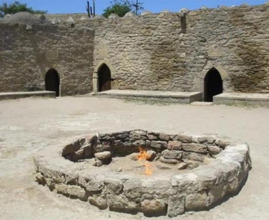 The Zoroastrian Ateshgah “Fire Temple” near Baku, Azerbaijan. The temple was built over natural burning vents which no longer provide gas, and so the flame is now artificially fed via a pipe. 