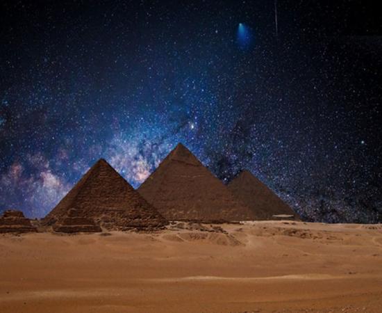 Egyptian pyramids under a night sky. Several researchers believe astronomical alignments at this site point to signs of an ancient advanced civilization.