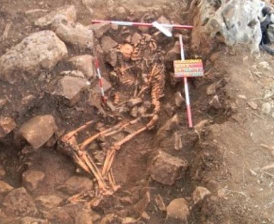 A rare ancient Greek gravesite containing two intertwined corpses