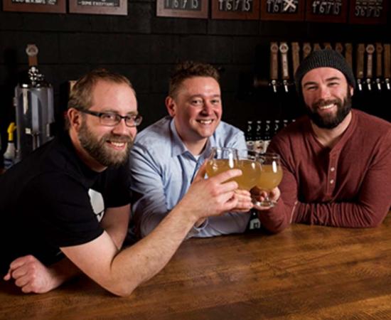 Left to right- Barn Hammer Brewing Company Head Brewer Brian Westcott, Matt Gibbs of the University of Winnipeg and Barn Hammer owner Tyler Birch teamed up to re-create an ancient beer. THE CANADIAN PRESS/David Lipnowski/The Conversation