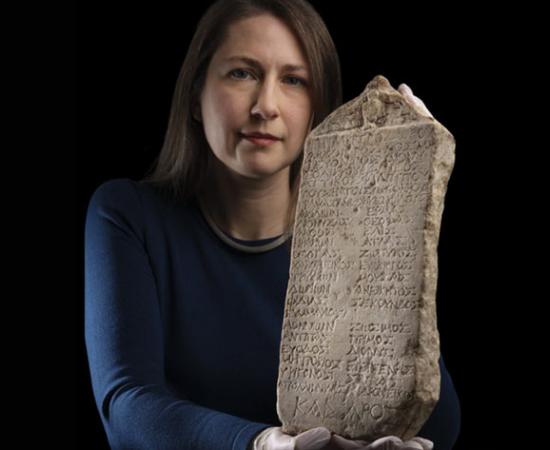 Dr. Margaret Maitland, Principal Curator of the Ancient Mediterranean at National Museums Scotland, with the recently discovered ancient Greek graduate yearbook. Source: National Museums Scotland
