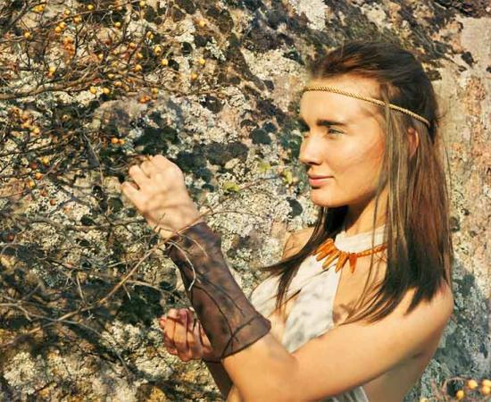A woman in the hunter-gatherer Stone Age collecting berries, which could be used for medicine or ancient makeup. The oldest ever evidence of makeup was connected to a ceramic object long thought to be a child's toy from 6,000 years ago in Slovenia! 	