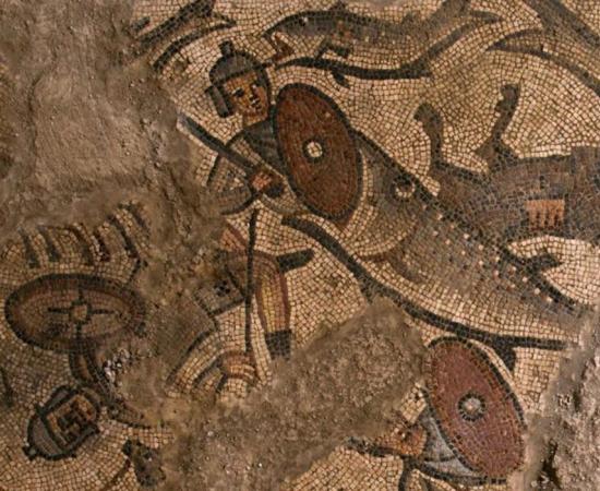 A big fish swallows an ancient Egyptian soldier on one of the mosaics found on the floor of the synagogue.