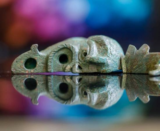 Photograph showing the bronze oil lamp unearthed in Jerusalem