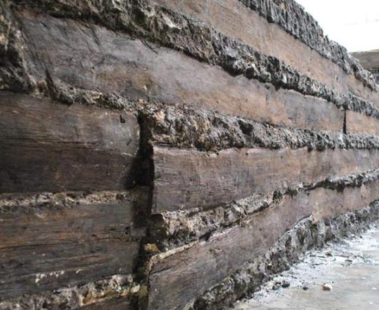 Some of the oak planks unearthed in the foundations of the portico. These planks are an example of those used for building Rome.      Source: Soprintendenza Speciale Archeologia, Belle Arti e Paesaggio di Roma, Italy