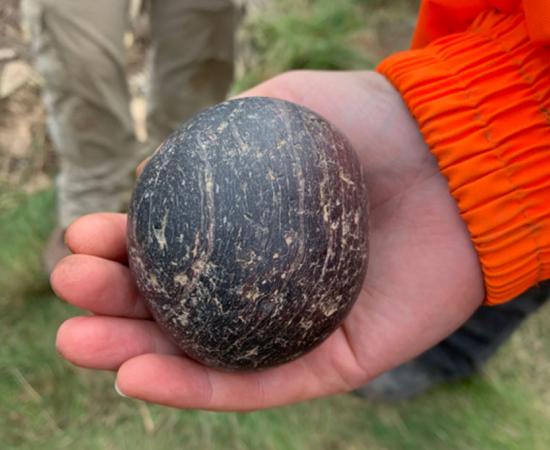 The first carved stone ball found at the Tress Ness, Sanday, Orkney Neolithic tomb site that “teeters” on the edge of the encroaching sea today.		Source: University of Central Lancashire
