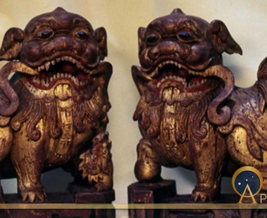 A pair of wooden shiziguo type lions decorated with gilt and polychrome.  The female has a cub, symbolizing a happy family.  Chinese, early Ching Dynasty (Image: © Walther G. von Krenner)