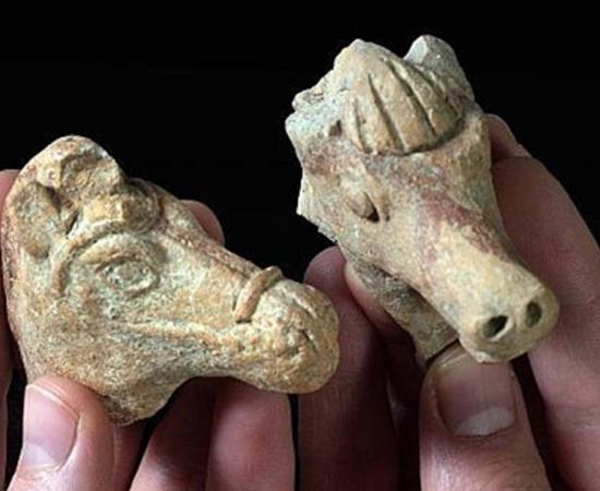 Left: The clay horse head from the Hellenistic period. Right: The Iron Age clay horse head