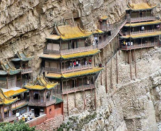 Pinned to the side of its cliff face is the Xuan Kong Si, also known as the Hanging Monastery of Mount Heng. (Public domain)