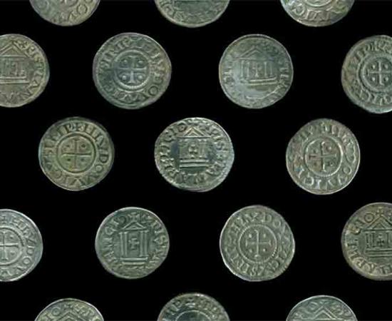 Some of the 118 Carolingian coins in the rare and unusual coin hoard found in northeastern Poland.