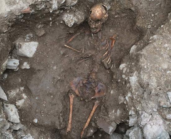 Italian archaeologists have unearthed the remains of a teenage  girl given a “deviant burial” because she appeared different from and possibly scared her fellow villagers. 