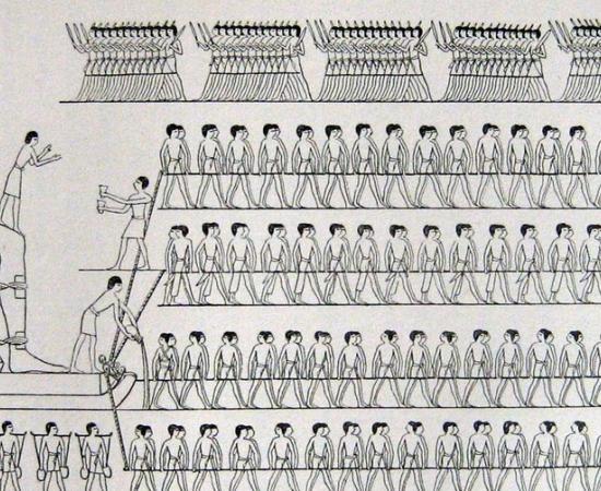 Nineteenth-century drawing of long teams of men hauling a colossal seated statue on a sledge, from the tomb of Djehutihotep at el-Bersheh