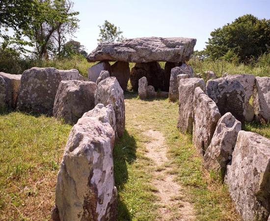 The dolmen of Faldouet is one of several Neolithic Jersey dolmens. It is a Neolithic passage grave located near St. Martin and a highlight for visitors to the island. Source: Lux / Adobe Stock
