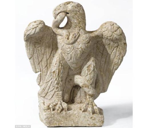 Eagle eating serpent sculpture