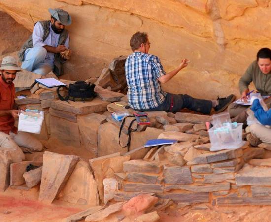 The natural cliff overhang provided protection from the elements, contributing to the remarkable preservation of the horn chamber.  Source: Royal Commission for AlUla