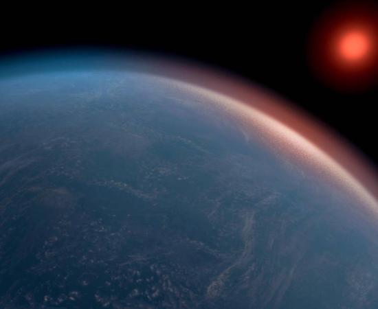 Artist’s conception of a big, blue K2-18b orbiting its red dwarf star.