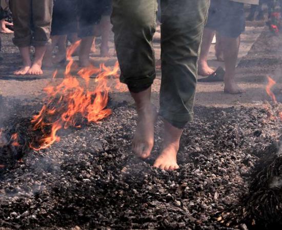 Firewalking over hot coals. Source: Tatyana / Adobe Stock