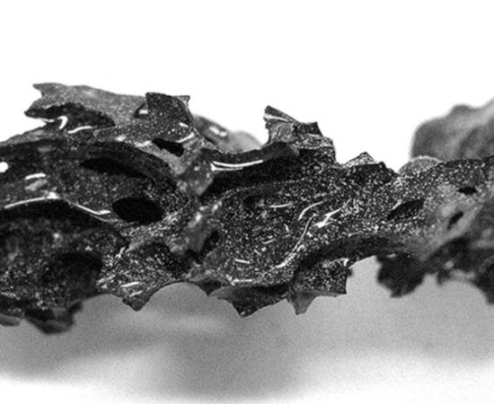 A piece of organic glass discovered within the skull of a man from ancient Herculaneum