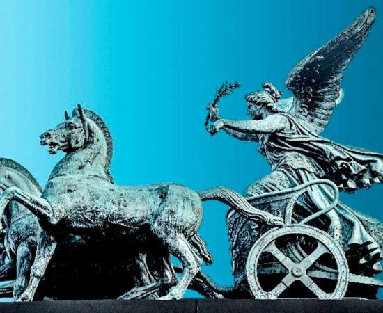 Bronze statue of Nike, Greek goddess of victory, on Austrian Parliament roof in Vienna, Austria	(neurobite / Adobe Stock)