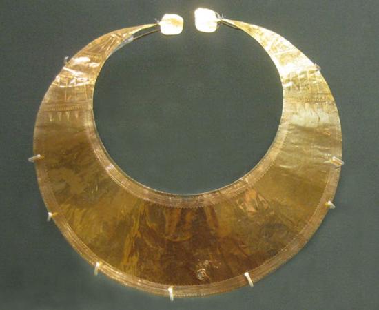 A gold lunula from County Wicklow. The piece, dating from 2400 BC to 2000 BC, is in the  British Museum. Note the decorations etched into the ends or horns of the lunula.