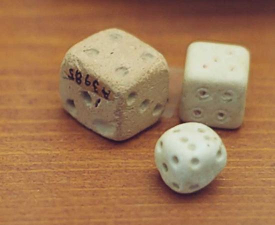 These Roman dice are not the sum of opposite sides of seven and are not symmetrical.
