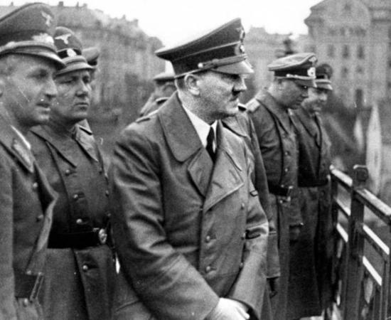 1941 picture of Adolph Hitler with several Nazi officials. On his immediate right is Martin Bormann, who was perhaps the most famous Nazi known to have escaped to South America after the war.