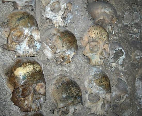 Close-up of human skulls that are part of the Chapel of Bones of the Church of San Francisco in Évora, Portugal. 