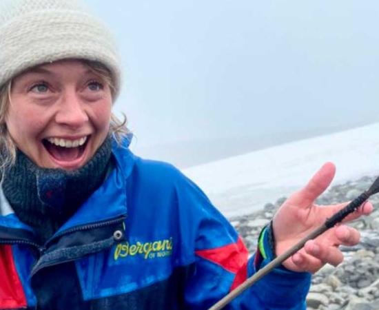 A Secrets of the Ice team member proudly holding up the latest ice patch arrow released by Norway’s melting Langfonne ice patch.Source: Secrets of the Ice
