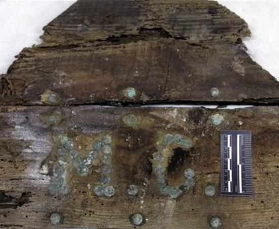Initials M.C on a plank of a coffin found on unidentified graves in the Convent of the Barefoot Trinitarians 