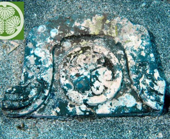 coat of arms of the Tokugawa shogun clan is seen embossed on this ridge-end gargoyle tile off Hatsushima island in Atami, Shizuoka Prefecture 