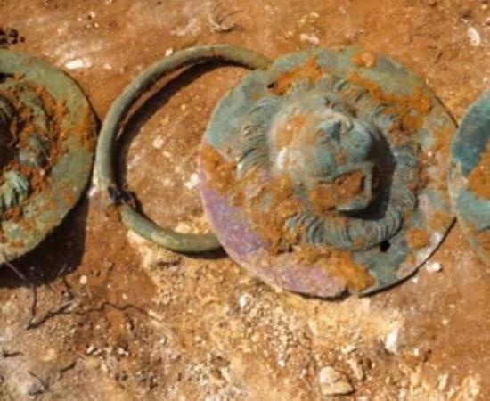 Three of the discs that were found inside the one Roman grave at Khirbat Ibreika.