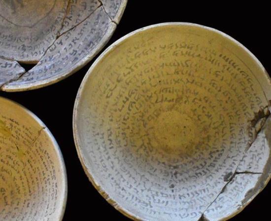 Authorities seized stolen artifacts, including three magic incantation bowls. Source: Yoli Schwartz / Israel Antiquities Authority