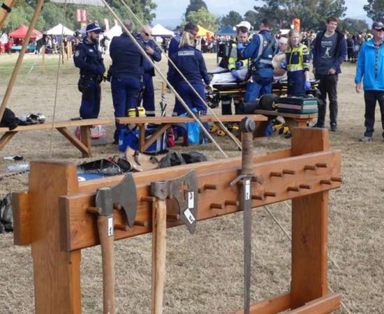 Paramedics aid man at Hawkesbury Showground in New South Wales after he was struck in the head with a Medieval axe