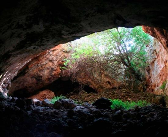 View of the cave ‘Cueva de los Marmoles’ entrance from inside, where the manipulated human remains have been found. Source: J.C. Vera Rodríguez/ PLoS ONE