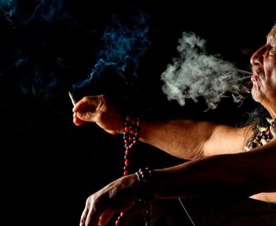 Marijuana and other plants have been used for medicinal, spiritual, and recreational purposes since time immemorial. The pictured Amazonian shaman uses ayahuasca ritualistically. Source: Ammit / Adobe Stock