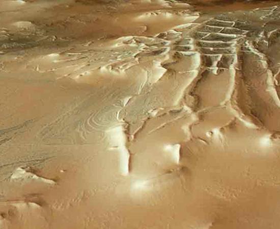 No Ziggy? The Inca City at the Martian Pole surrounded by thousands of spiders from Mars, here seen as tiny dark spots. Source: European Space Agency / CC-BY-SA 3.0.