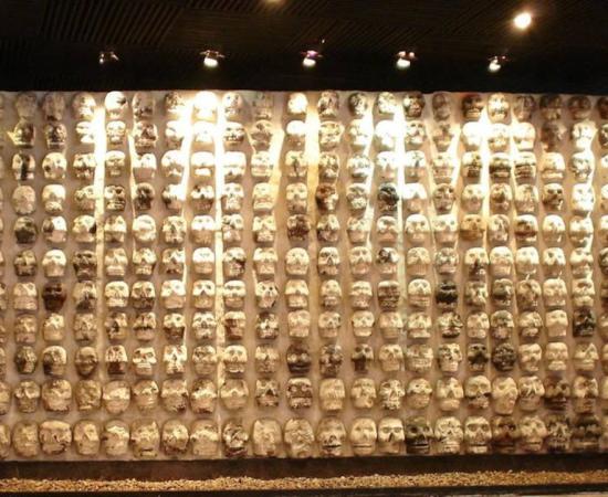 Display of wooden rack filled with skulls, used by Mesoamerican societies (including the Maya) to display the heads of sacrificial victims, at the Templo Mayor Museum in Mexico City. 