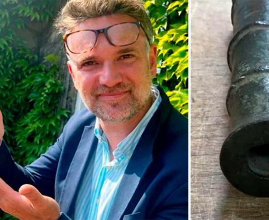 Charles Hanson, the owner of Hansons Auctioneers, holding the 600-year-old medieval hand cannon. 	Source: Hansons Auctioneers