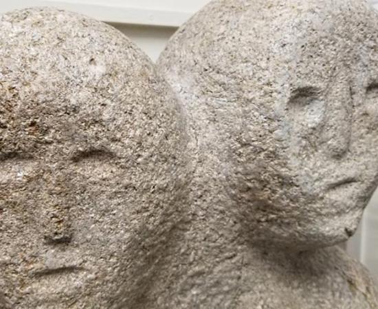 A stone statue of the mysterious moon-eyed people who may have been an ancient white race that interbred with the Native Americans long before the Europeans came to North America.		Source: Strange Carolinas