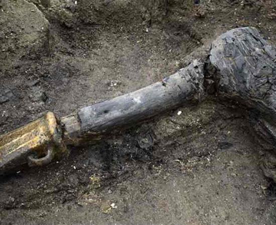 The remains of the axe placed underneath Structure One at Must Farm Bronze Age Settlement. Source: Cambridge Archaeological Unit