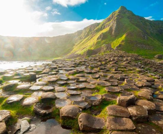 Visiting mythical places, like the Giant’s Causeway in Northern Ireland pictured, helps us connect with our past, as well as nature. Source: drimafilm / Adobe Stock 