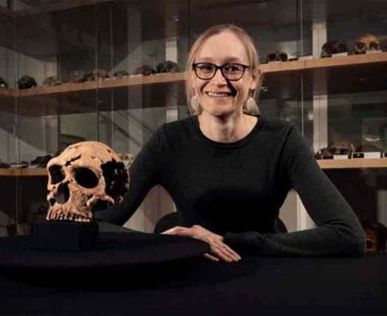 Dr Emma Pomeroy (University of Cambridge) with the skull of Shanidar Z in the Henry Wellcome Building in Cambridge, home of the University’s Leverhulme Centre for Human Evolutionary Studies. 	Source: BBC Studios/Jamie Simonds/University of Cambridge