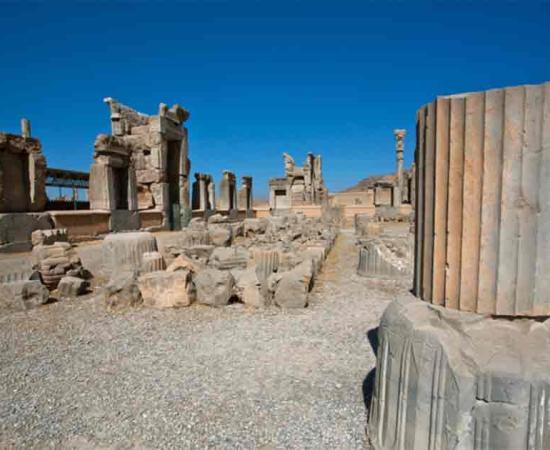 Landscape with ruined city and stone columns in Persepolis. UNESCO World Heritage Site. Source: radiokafka/Adobe Stock